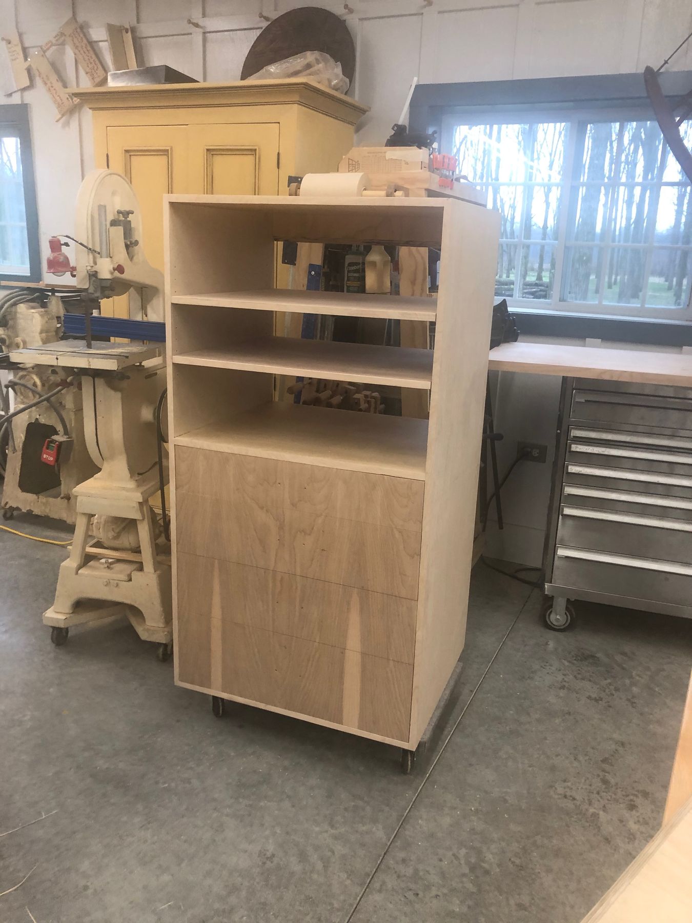 Modern birch cabinet with open shelves above drawers