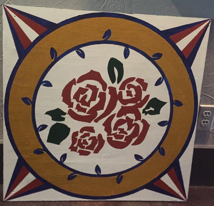 Hand-painted barn quilt with roses