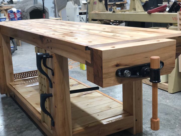 Heavy hardwood workbench with a leg vise and bench-dog holes